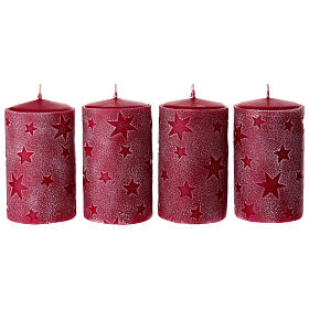 Set of 4 red candles with embossed stars, 5x3 in
