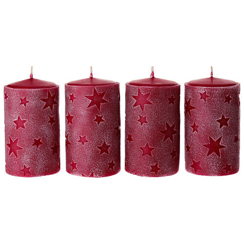 Set of 4 red candles with embossed stars, 5x3 in 1