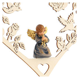 Christmas decor angel with trumpet on heart