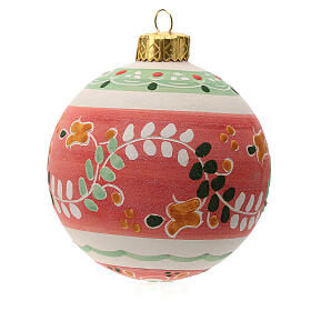 Red round Christmas bauble in terracotta