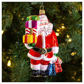 Santa Claus with gifts, Christmas tree decoration in blown glass