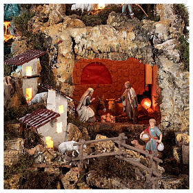 Nativity village, illuminated with waterfall, stable and mill