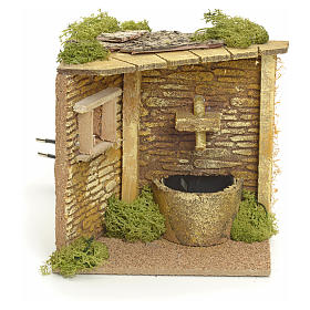 Nativity setting, house corner with electric fountain
