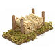 Nativity accessory, wood stack on moss with straw s2