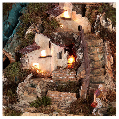 Nativity village with fire, lights, waterfall and pond 55x75x50 cm 4