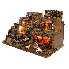 Nativity village, stable with fire and waterfall 40x58x38cm