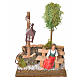 Nativity setting, woman sitting on bench with lamp s1