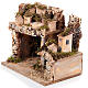 Nativity scene setting with houses and grotto s2