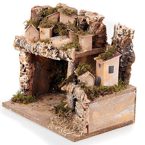Nativity scene setting with houses and grotto 2