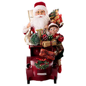 Papá Noel en trineo con regalo luces movimientos 40x40x20 cm