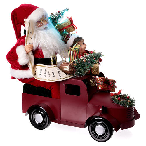 Papá Noel en trineo con regalo luces movimientos 40x40x20 cm 4