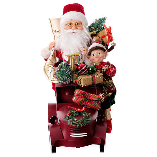 Papá Noel en trineo con regalo luces movimientos 40x40x20 cm 11