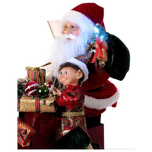 401003 Père Noël Boîte cadeaux décoration avec lumières et mouvement  29x20x42cm
