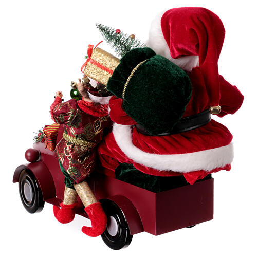 Babbo Natale su slitta con regali luci movimento 40x40x20 cm 8