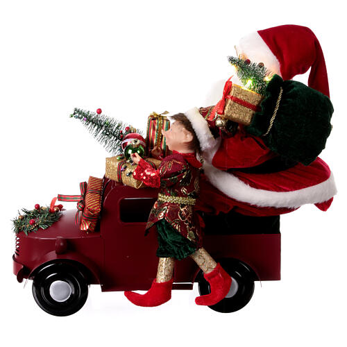Pai Natal no carro com presentes luzes e movimento 40x40x20 cm 10