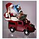 Pai Natal no carro com presentes luzes e movimento 40x40x20 cm s5