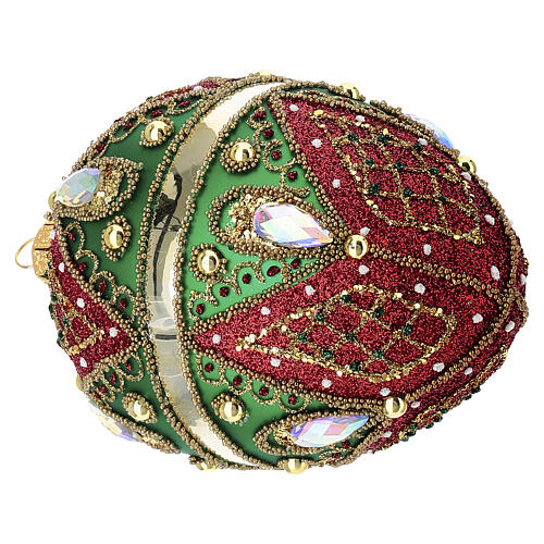 Hand-decorated green and red blown glass egg-shaped bauble, 5x3 in 4