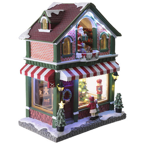 Animated LED Christmas toy shop village, 40x35x20 cm 4