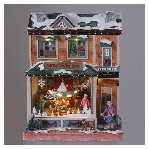 Tienda juguetes navidad led y música 30x25x15 cm 2