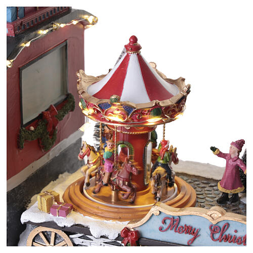 Treno natalizio animato luci led elfo e giostre 25x50x15 cm 5