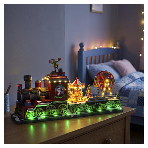 Animated Christmas train with LED lights, elf and carousel 25x50x15 cm 2