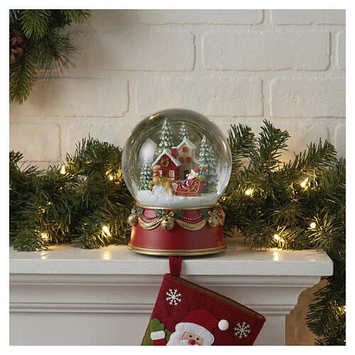 Globo de neve de vidro com caixa de música Pai Natal com trenó 15x10 cm 2