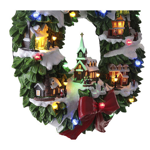 Couronne murale avec maisons de Noël 60x53x10 cm 8