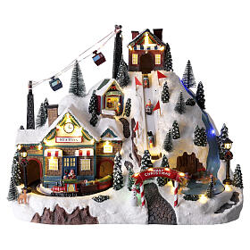 Village de Noël montagne illuminé et animé 35x50x30 cm