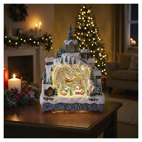 Aldeia de Natal em arco com Pai Natal no trenó efeito purpurina 35x25x10 cm 2