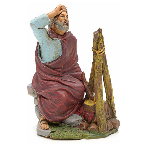 Nativity set figurine, shepherd sitting next to fire 13cm 1
