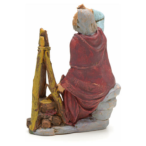 Nativity set figurine, shepherd sitting next to fire 13cm 2