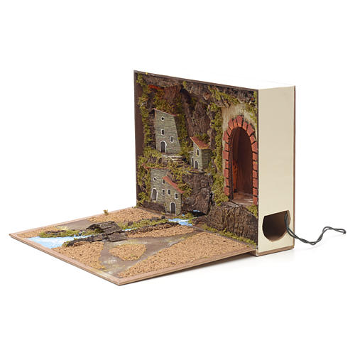 Illuminated village with river for nativities inside a book 24x3 2