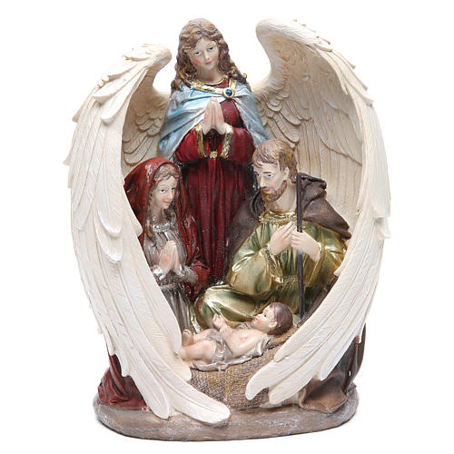 Holy family with angel measuring 31cm, in resin with natural finish 1