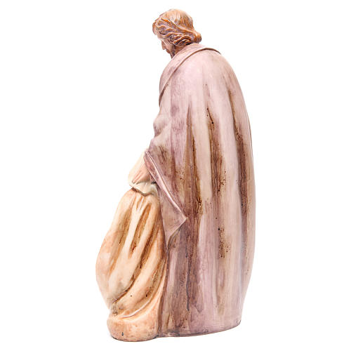 Nativity with base in coloured resin measuring 39cm 3