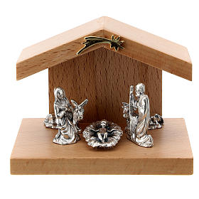 Nativity scene in metal with pear wood shack 5 cm