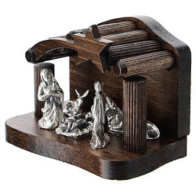 Nativity in metal with dark wood shack 5 cm