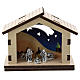 Nativity in metal with wood shack and printed desert in the background 5 cm s1