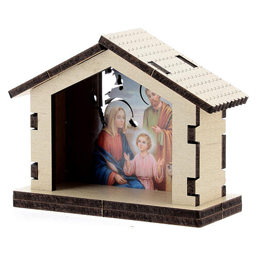 Wooden stable with Holy Family in the background 2