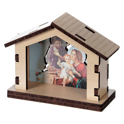 Häuschen aus Holz mit einer Szene der Heiligen Familie im Hintergrund 2