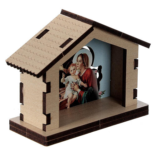 Häuschen aus Holz mit einer Szene der Heiligen Familie im Hintergrund 3