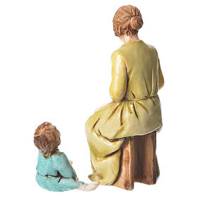 Kobieta wspominająca i dziecko 10 cm Moranduzzo
