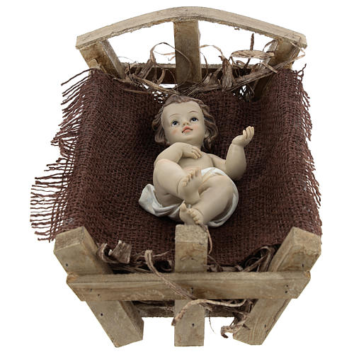 Dzieciątko Jezus w drewnianej kołysce żywica 25 cm (rzeczywista h) 1