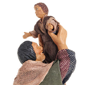 Nativity figurine man lifting up child 14cm