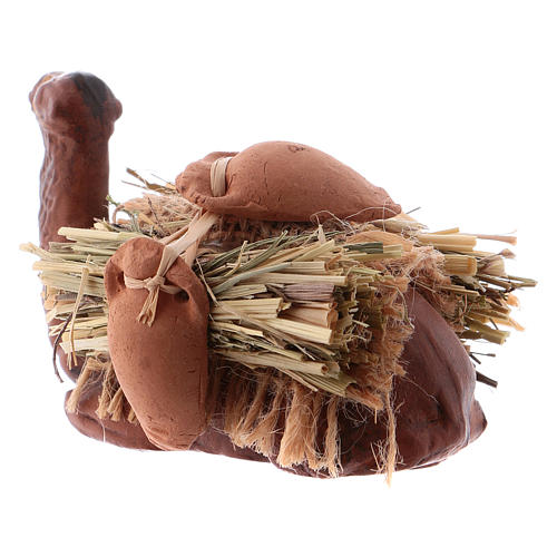 Neapolitan Nativity figurine, kneeling camel with wood bundle, 8 6