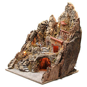 Illuminated village with stream and grotto 68x64x56cm