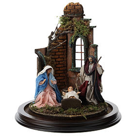 Neapolitan nativity scene on a wooden base with a glass domed roof