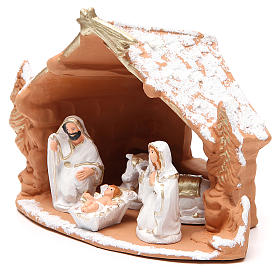 Nativity decorated terracotta with hut and snow h. 20x14x18cm