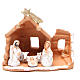 Nativity in painted terracotta and snow 15x16x9cm s1