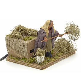 Animated Nativity scene figurine, peasant with hay 10 cm