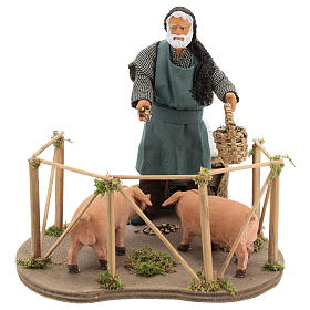 Animated Nativity scene figurine, man feeding pigs 14cm